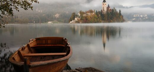 brown wooden boat floating on body of water